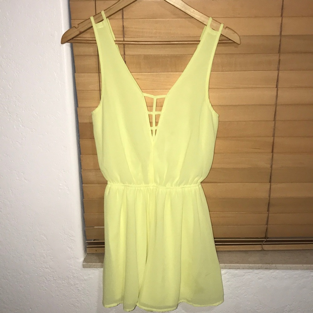 Bright yellow open back romper